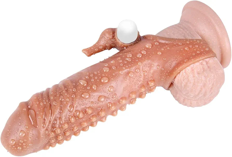A realistic flesh-toned dildo with a textured, bumpy surface, a flared base, and a small white spherical protrusion near the top, shown on a plain white background.